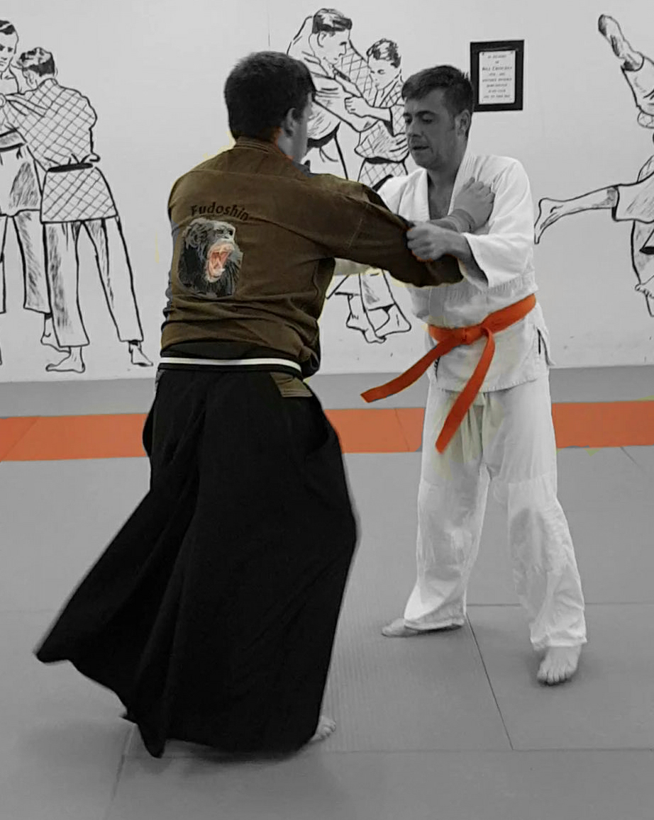 Two people wrestling for advanatage.