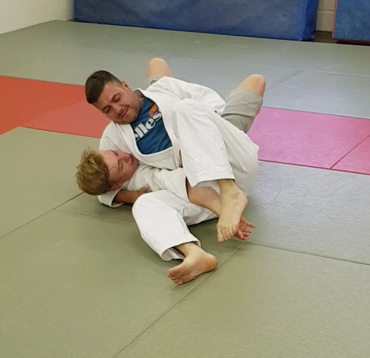 Showing the Ne Waza technique, Hon Kesa Gatame or scarf hold.